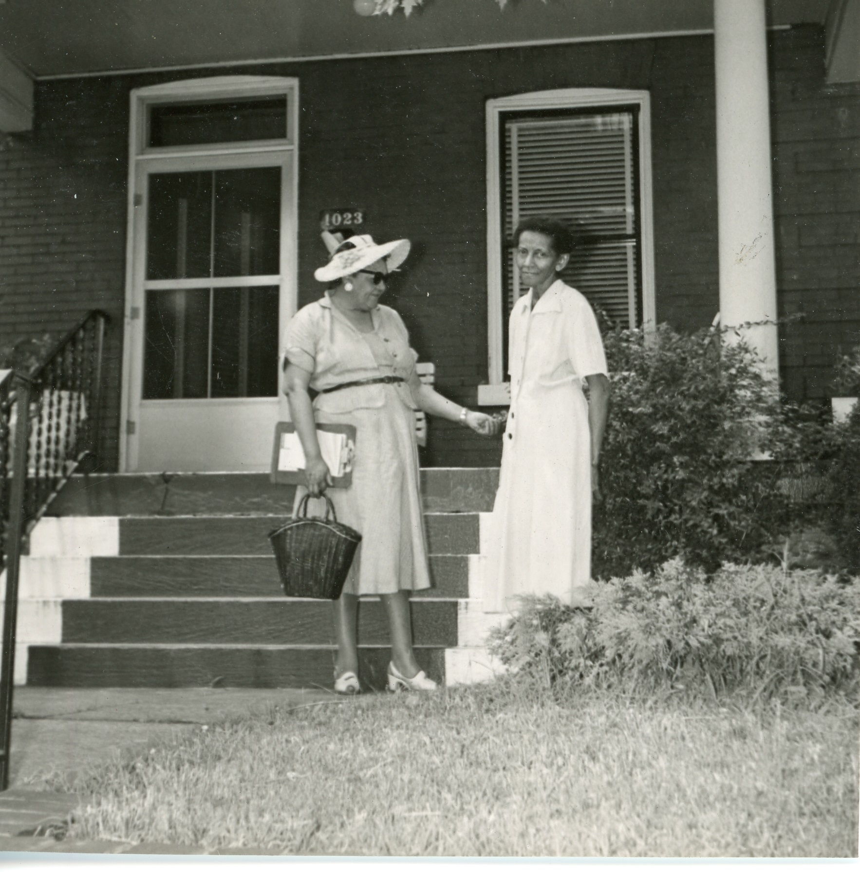 View of 1023 15th Ave S with possibly Jane's mother outside